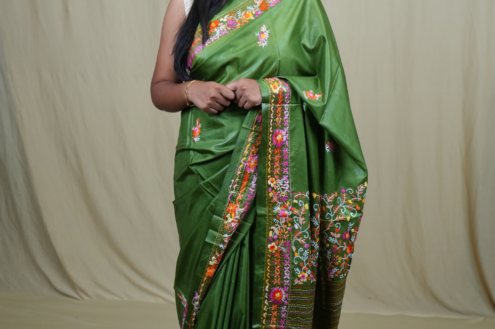 Semi Tussar saree with all-over thread woven motifs and rich Parsi work pallu.
