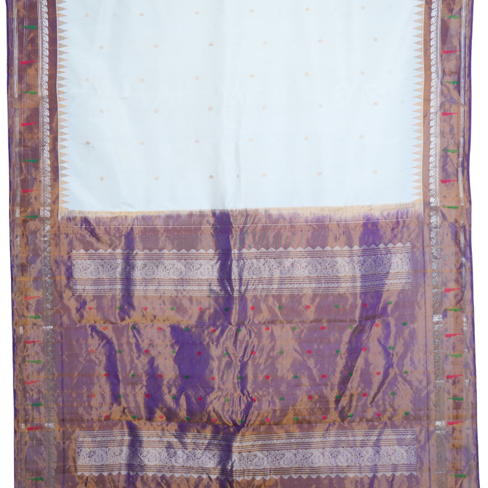 Traditional handloom Gadwal pure silk saree with zari woven tissue borders suitable for weddings.