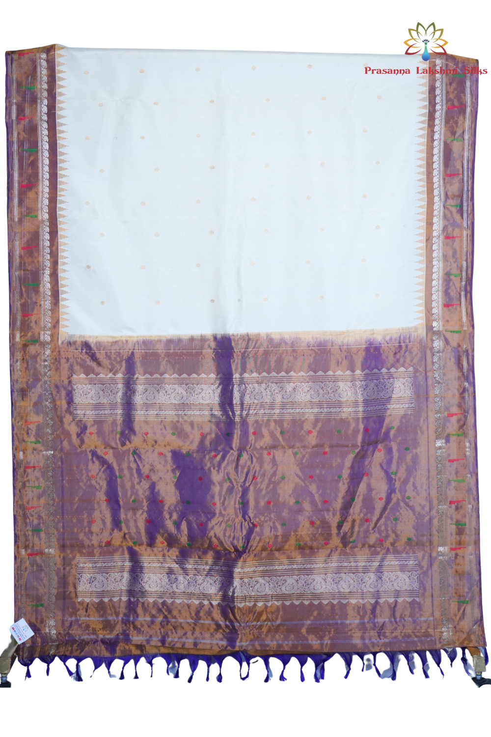 Traditional handloom Gadwal pure silk saree with zari woven tissue borders suitable for weddings.