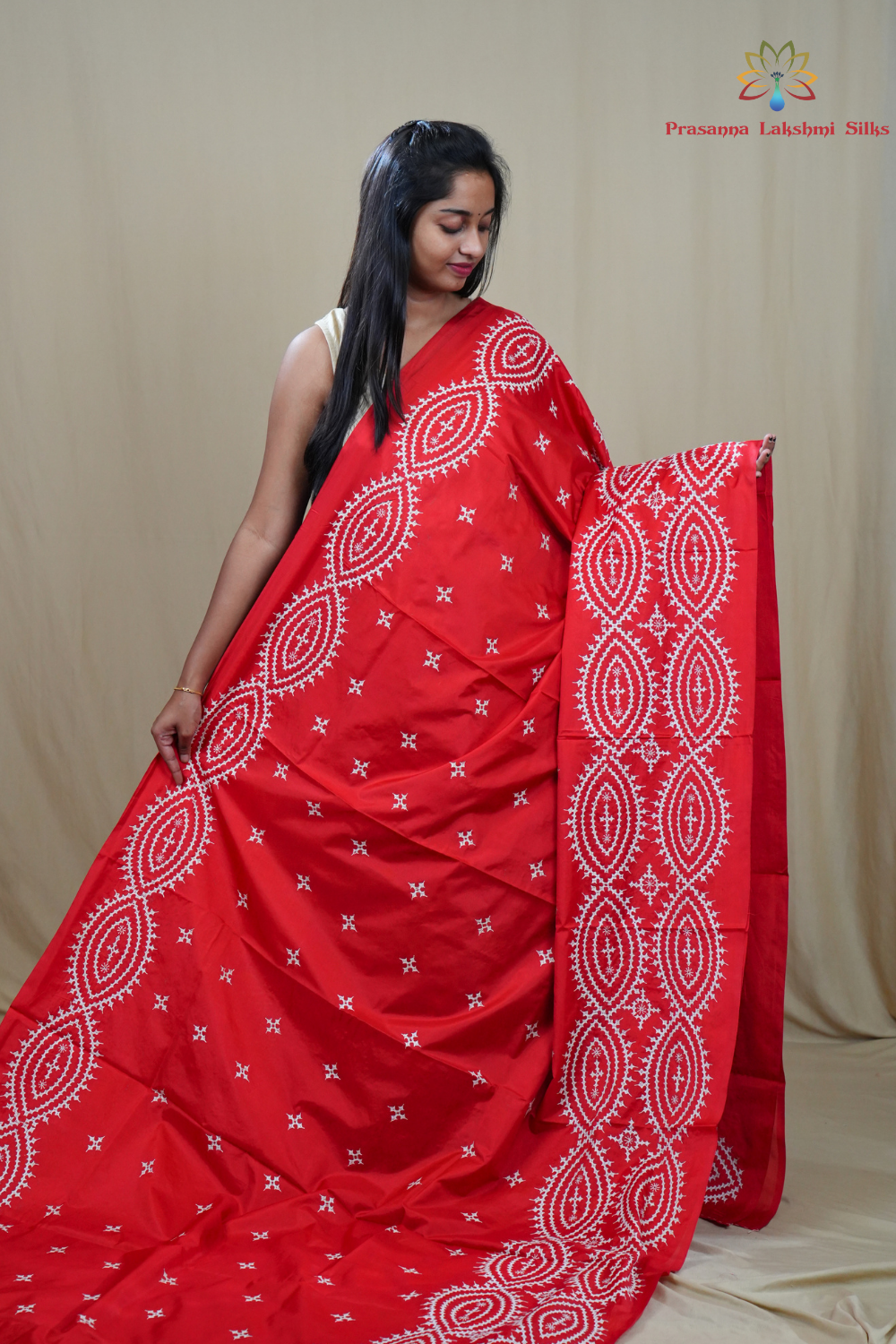 Traditional semi silk saree featuring beautiful hand Kutch work borders and artistic design.
