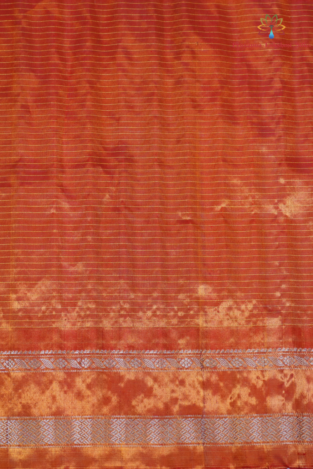 Elegant Gadwal tissue silk saree featuring brocade tissue pallu and contrast blouse.
