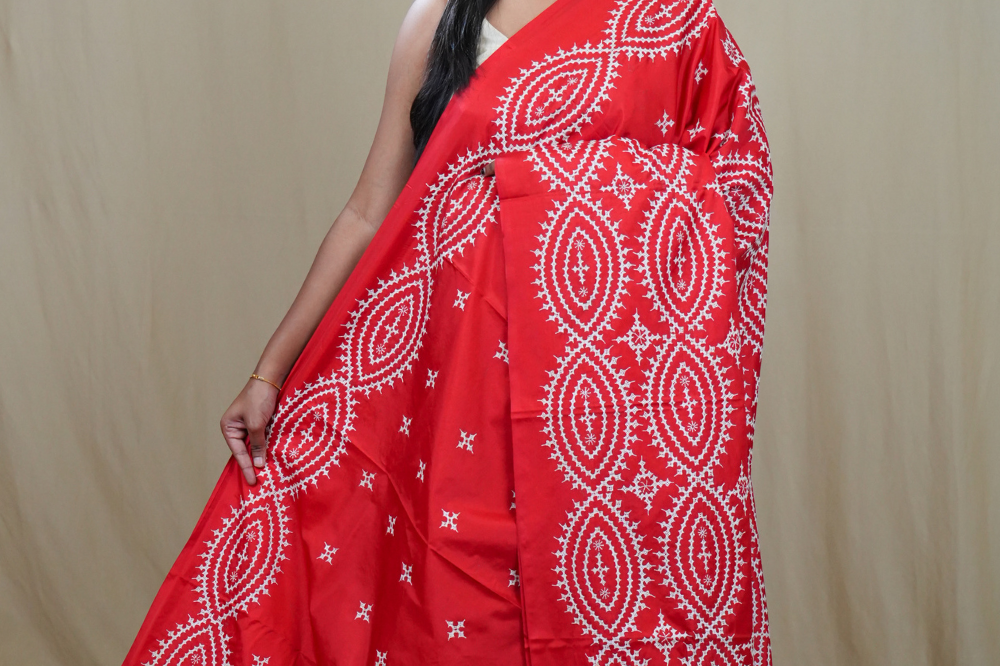 Semi Bangalore Silk Saree with all-over Kutch work motifs and rich embroidered pallu.

