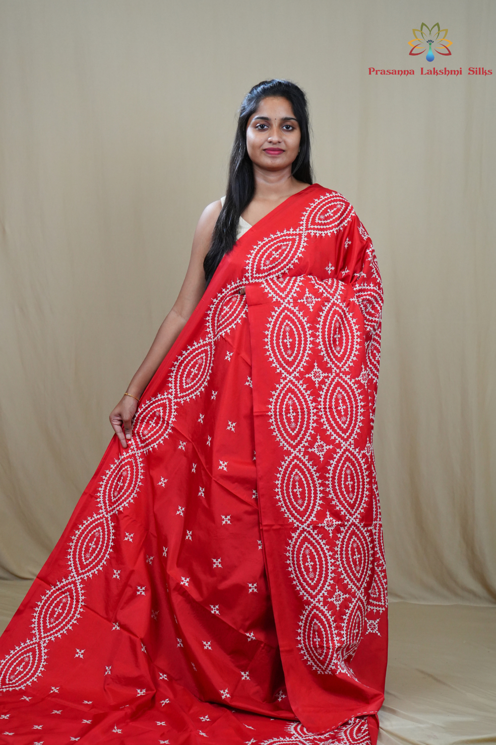 Semi Bangalore Silk Saree with all-over Kutch work motifs and rich embroidered pallu.
