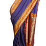 Handloom Gadwal pure tissue silk saree with intricate zari motifs and muniya borders.
