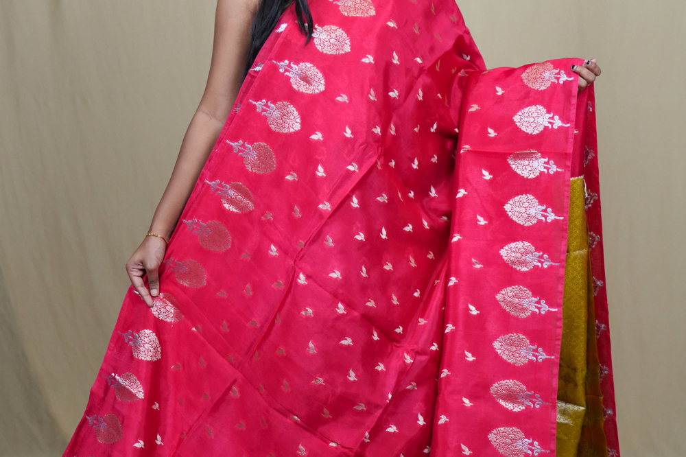 Traditional Banarasi silk saree featuring rich brocade pallu and matching brocade blouse.
