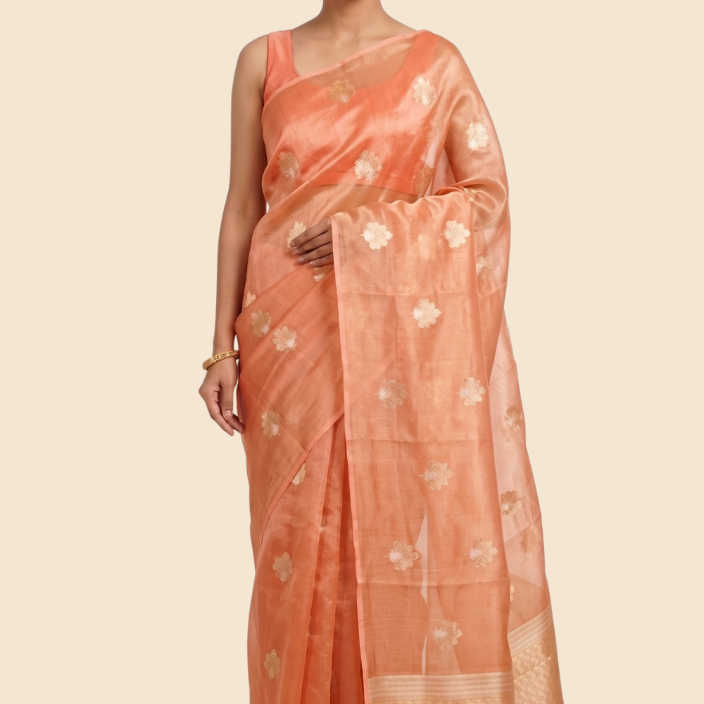 Kora tissue saree with allover gold flower motifs and silver highlights
