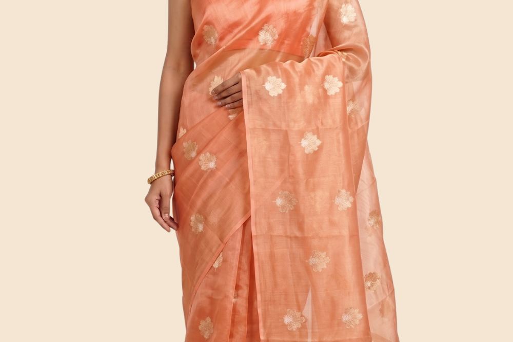 Kora tissue saree with allover gold flower motifs and silver highlights
