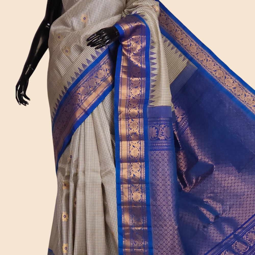 Handloom Gadwal pure silk saree with classic checks pattern and rich zari brocade pallu.
