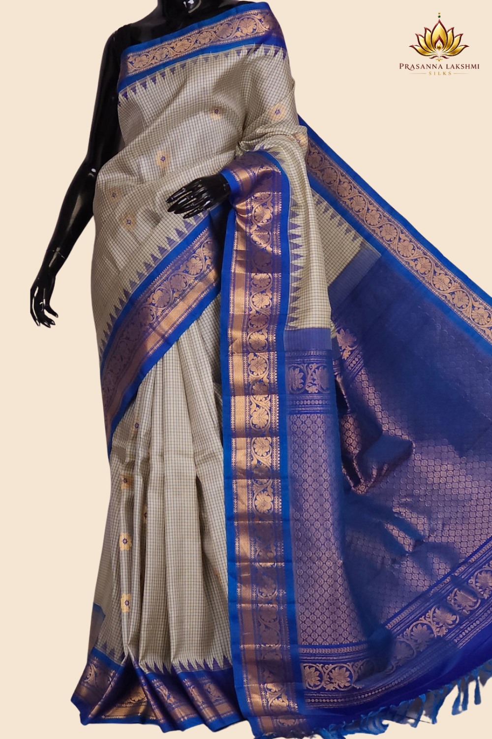 Handloom Gadwal pure silk saree with classic checks pattern and rich zari brocade pallu.
