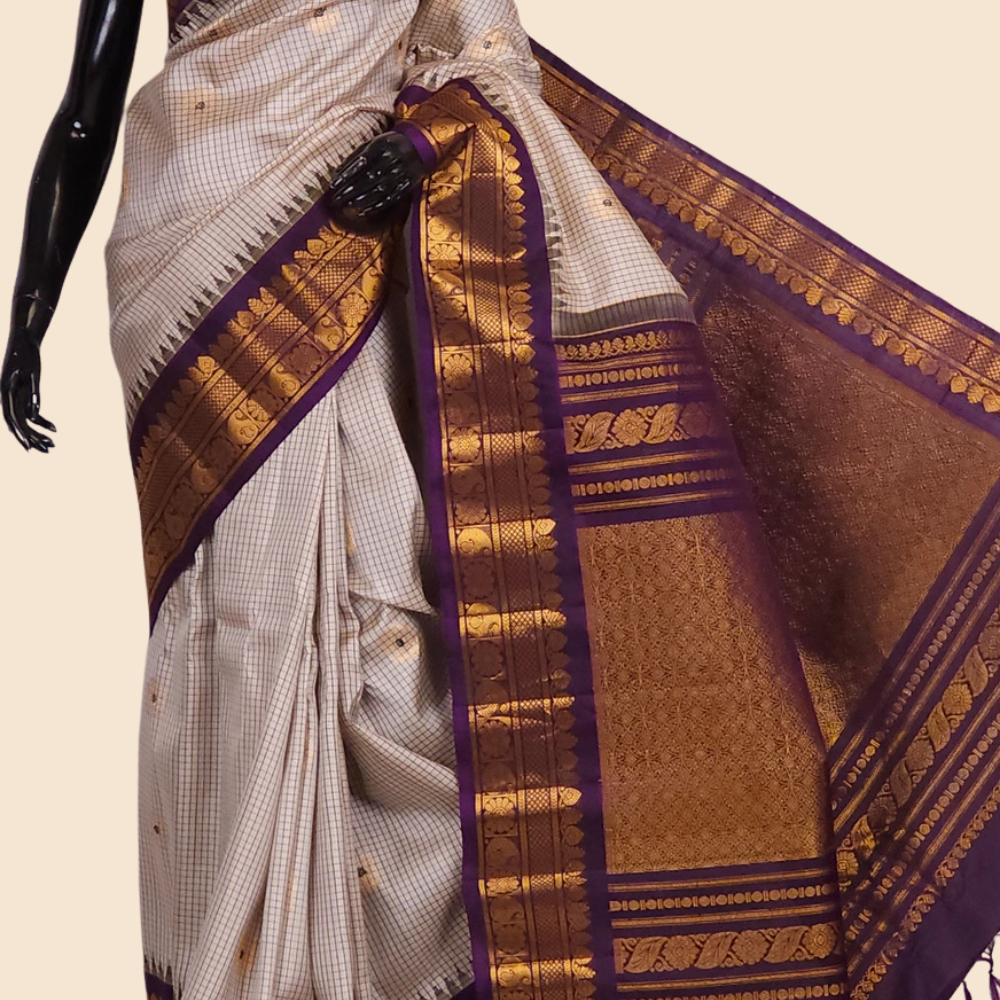 Handloom Gadwal pure silk saree with classic checks pattern and rich zari brocade pallu.
