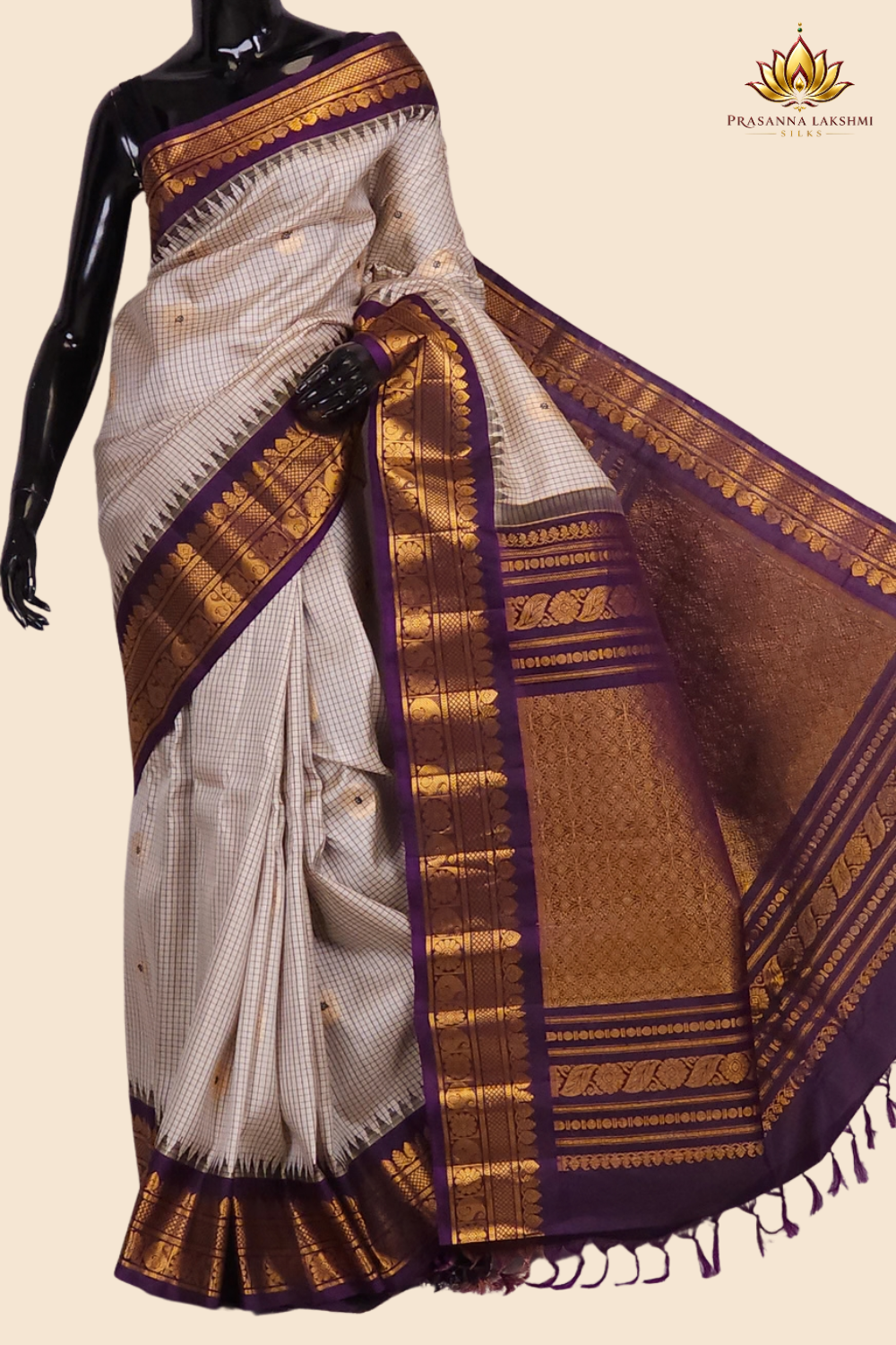 Handloom Gadwal pure silk saree with classic checks pattern and rich zari brocade pallu.
