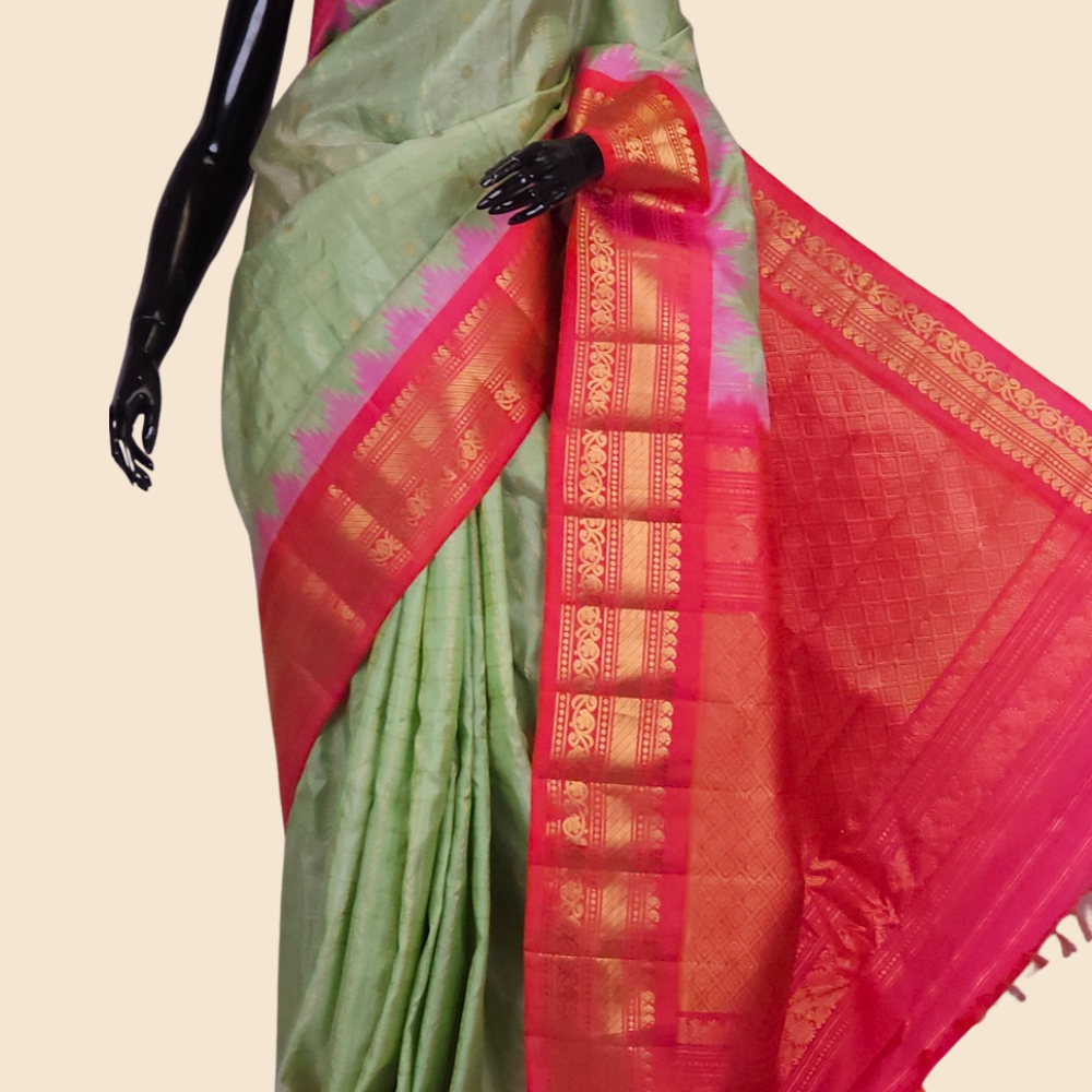 Handloom Gadwal pure silk saree with classic checks pattern and rich zari brocade pallu.
