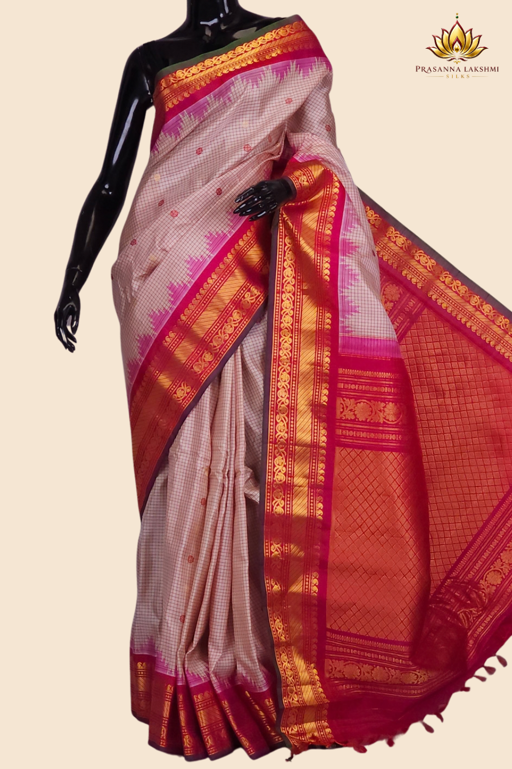 Handloom Gadwal pure silk saree with classic checks pattern and rich zari brocade pallu.
