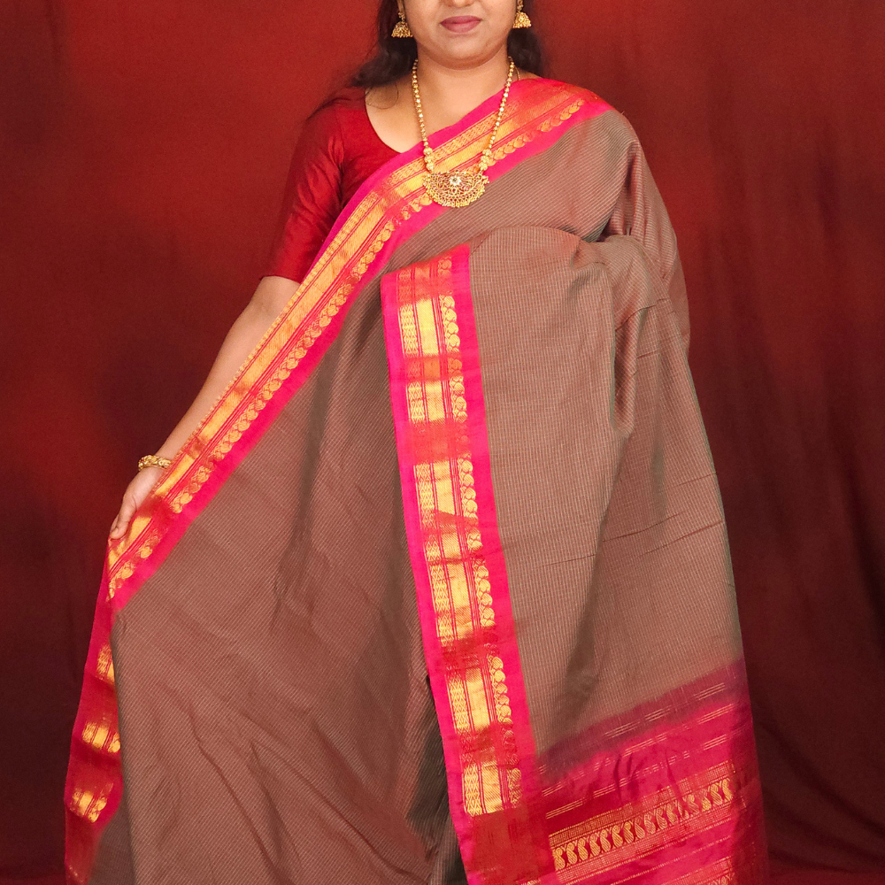 Lightweight Gadwal cotton saree featuring elegant zari border and striped pallu design.
