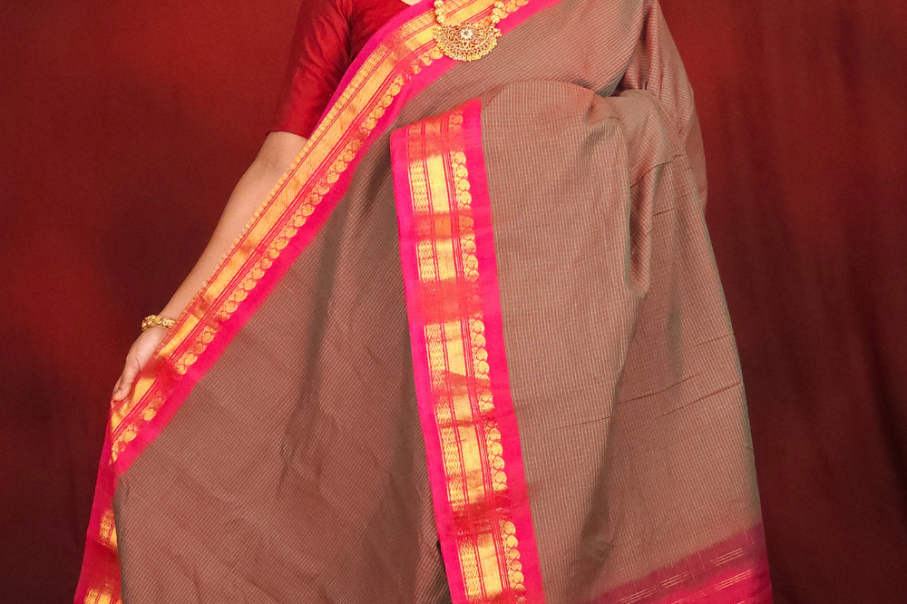 Lightweight Gadwal cotton saree featuring elegant zari border and striped pallu design.
