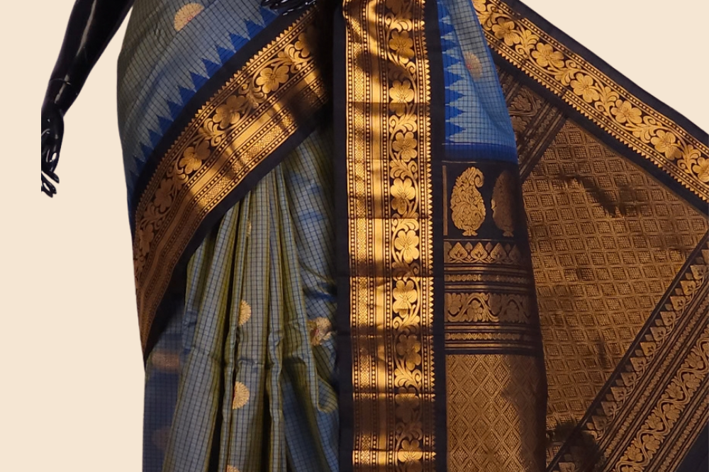 Handloom Gadwal pure silk saree with classic checks pattern and rich zari brocade pallu.
