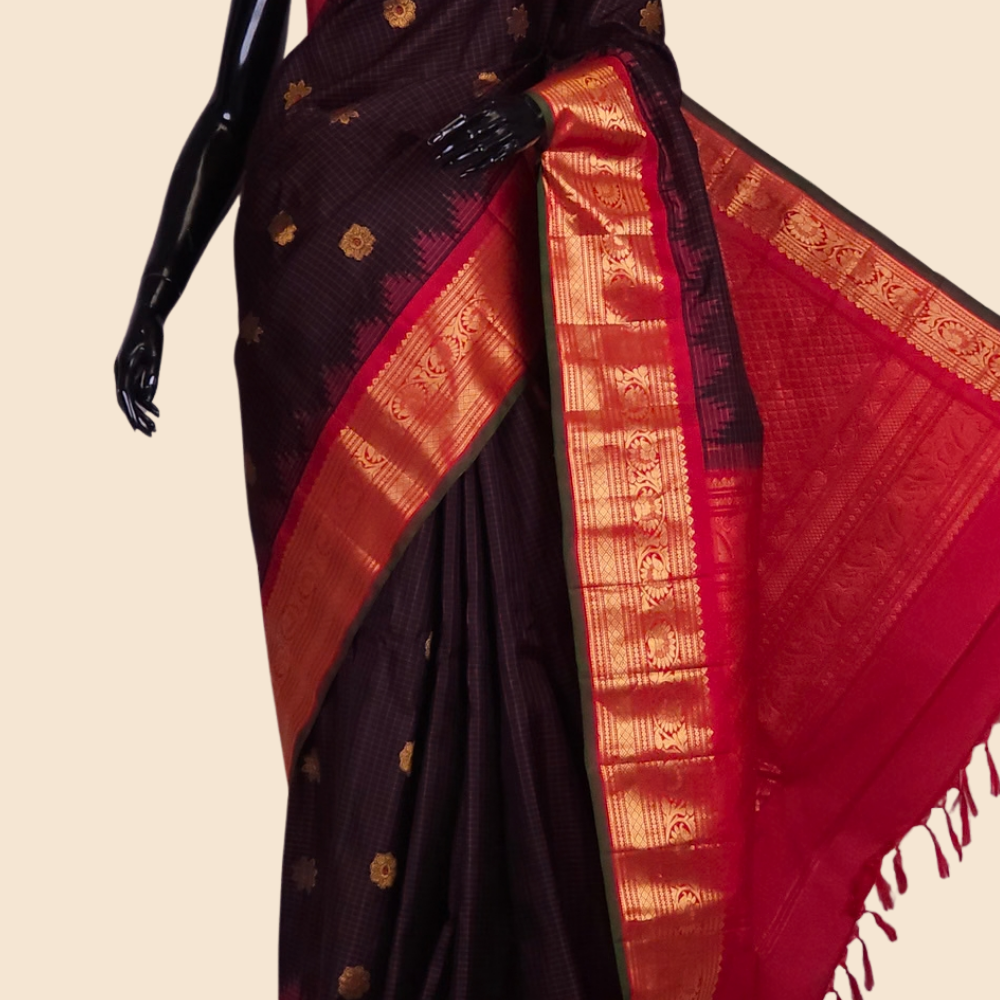 Handloom Gadwal pure silk saree with classic checks pattern and rich zari brocade pallu.
