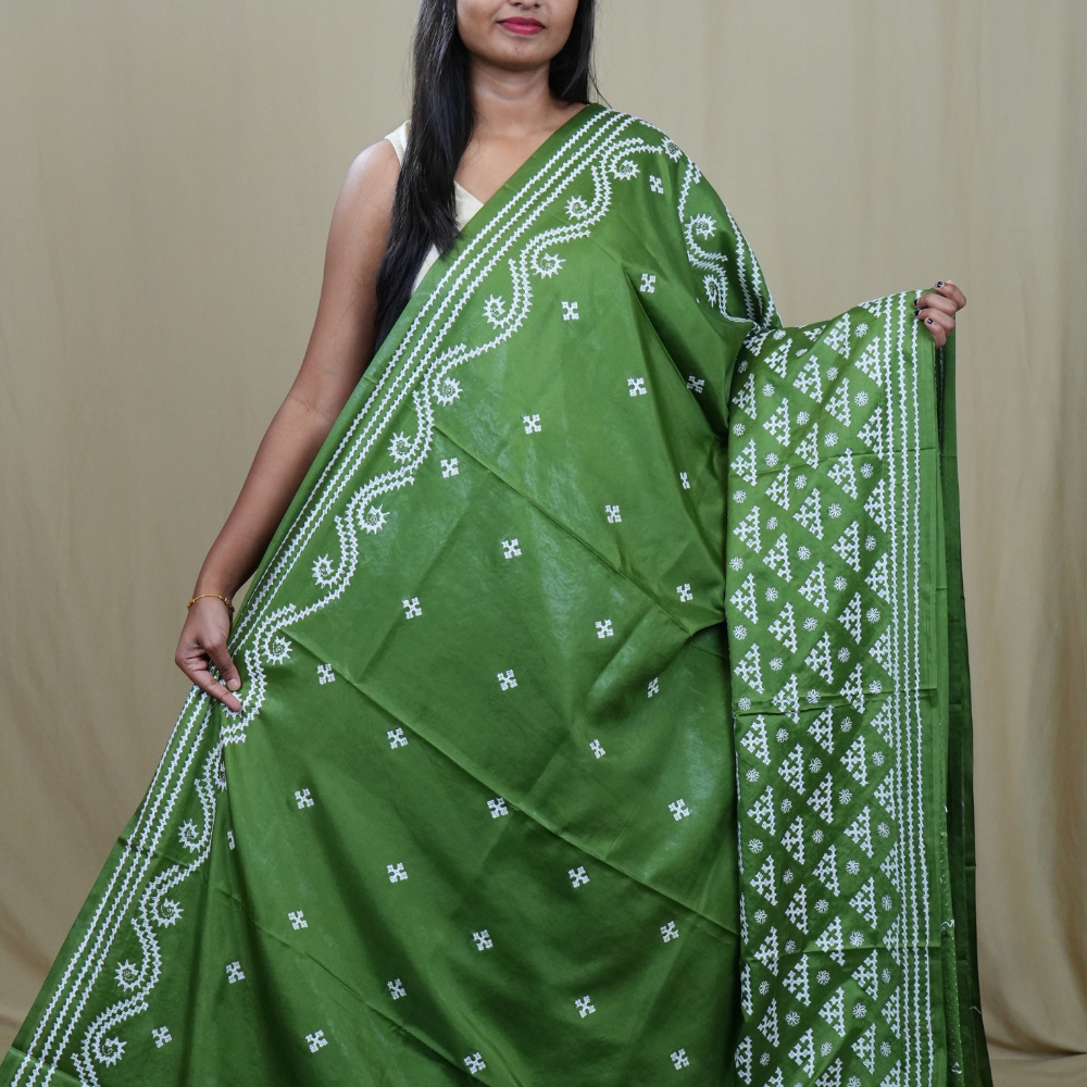 Traditional semi silk saree featuring beautiful hand Kutch work borders and artistic design.
