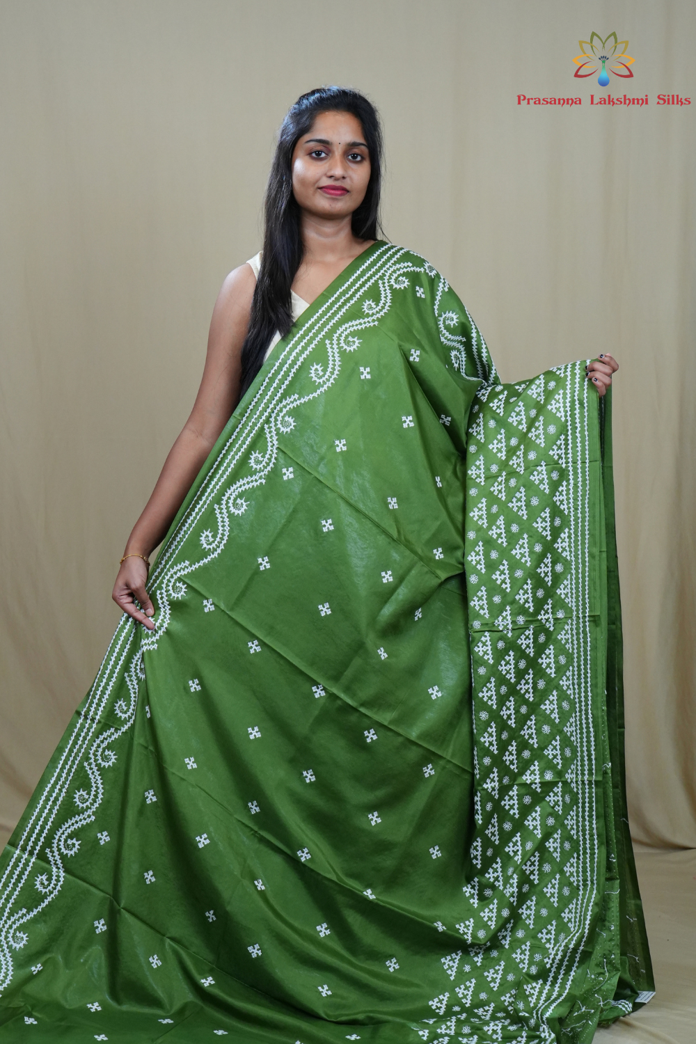 Traditional semi silk saree featuring beautiful hand Kutch work borders and artistic design.
