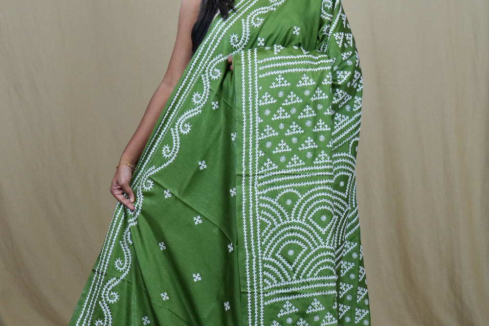 Semi Bangalore Silk Saree with all-over Kutch work motifs and rich embroidered pallu.

