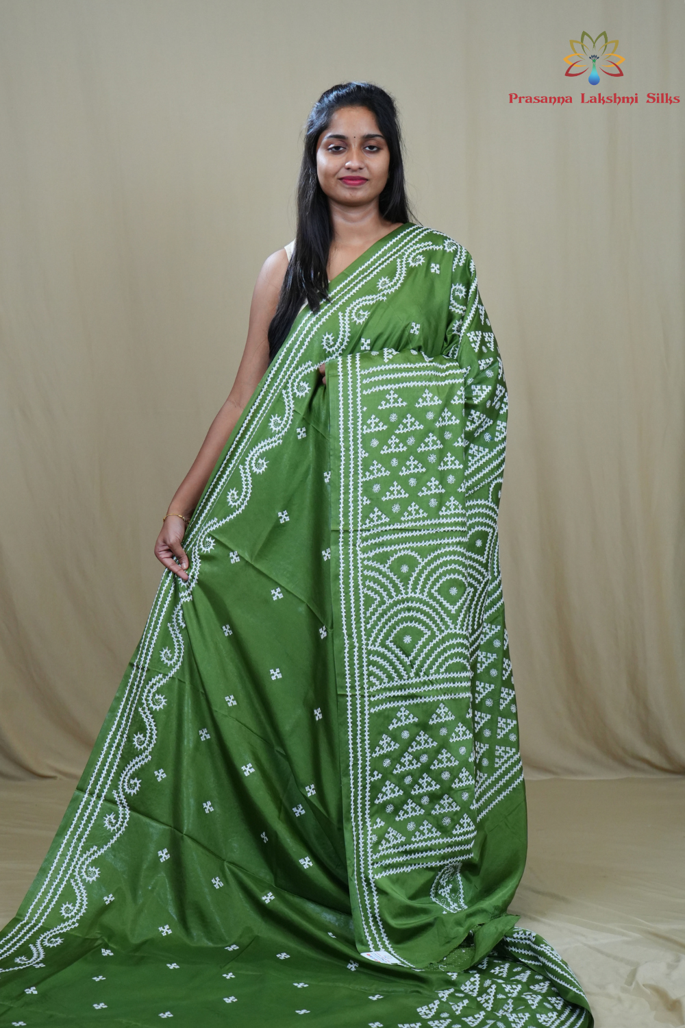 Semi Bangalore Silk Saree with all-over Kutch work motifs and rich embroidered pallu.
