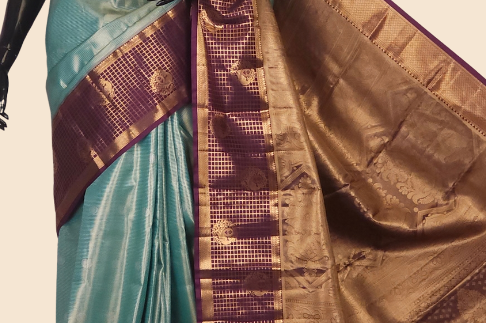 Semi Kanjeevaram silk saree with allover zari checks and motifs and contrast zari border
