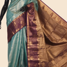 Semi Kanjeevaram silk saree with allover zari checks and motifs and contrast zari border
