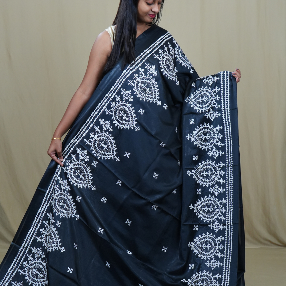 Traditional semi silk saree featuring beautiful hand Kutch work borders and artistic design.
