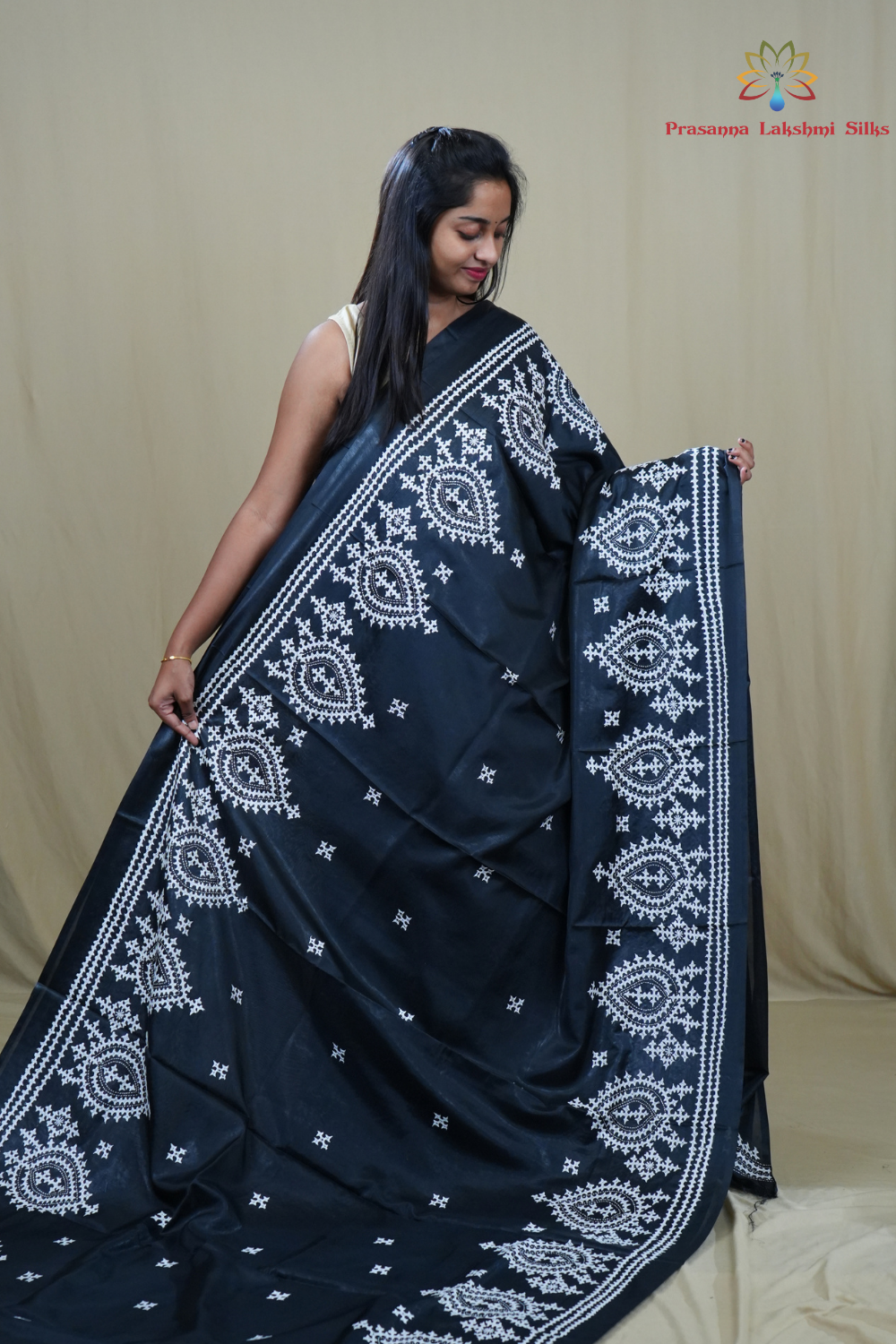 Traditional semi silk saree featuring beautiful hand Kutch work borders and artistic design.
