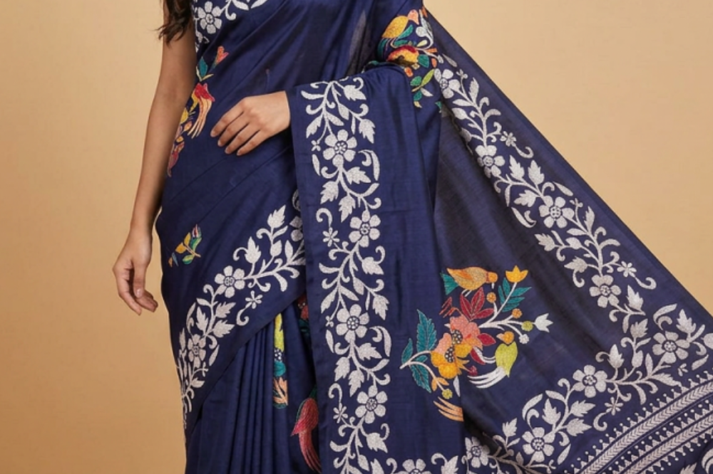 Semi Bangalore silk saree with all-over hand Kantha work and rich embroidered pallu.
