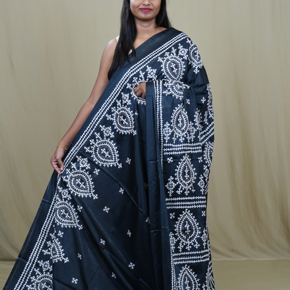 Semi Bangalore Silk Saree with all-over Kutch work motifs and rich embroidered pallu.
