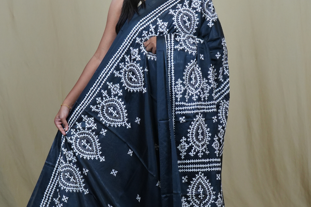 Semi Bangalore Silk Saree with all-over Kutch work motifs and rich embroidered pallu.
