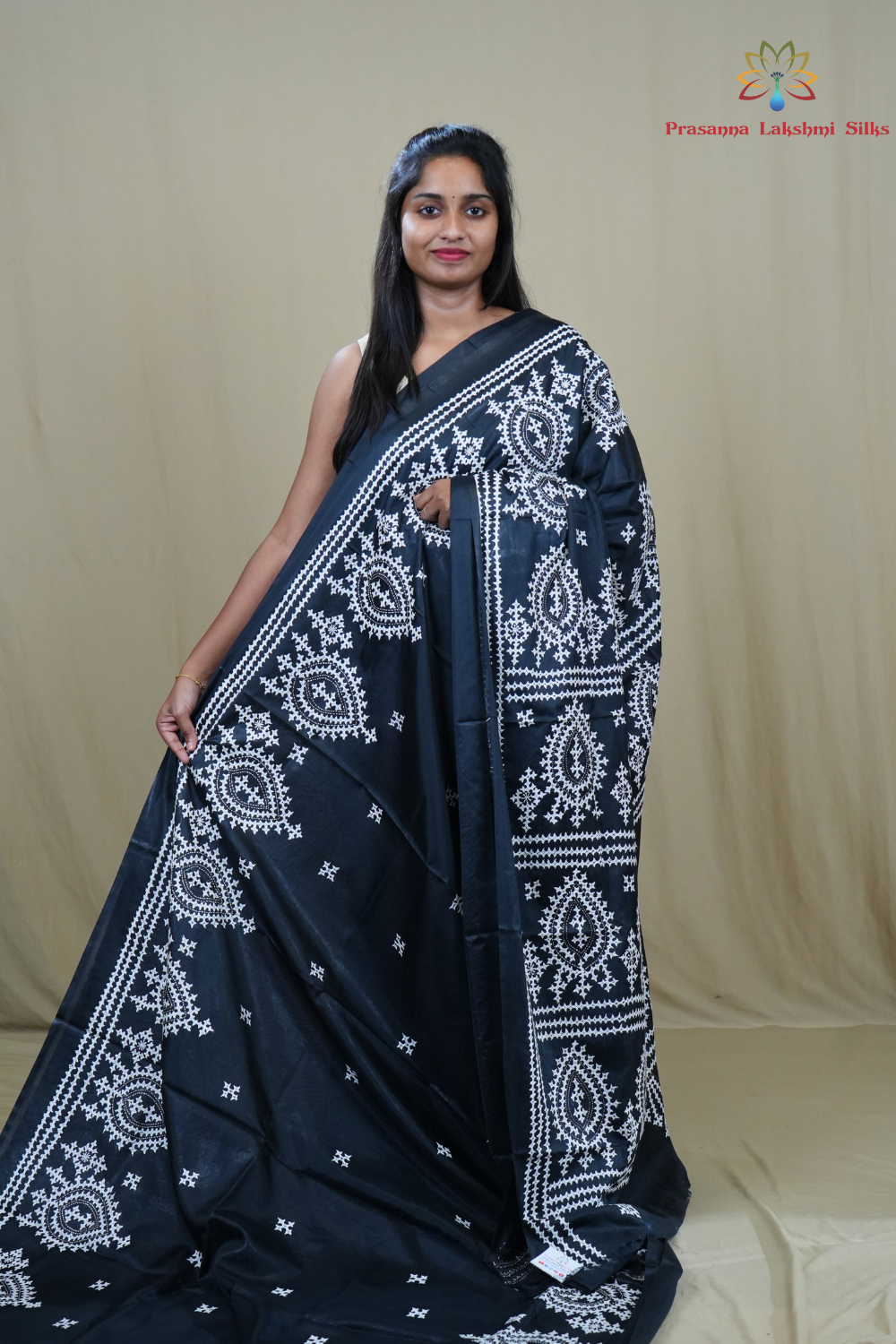 Semi Bangalore Silk Saree with all-over Kutch work motifs and rich embroidered pallu.
