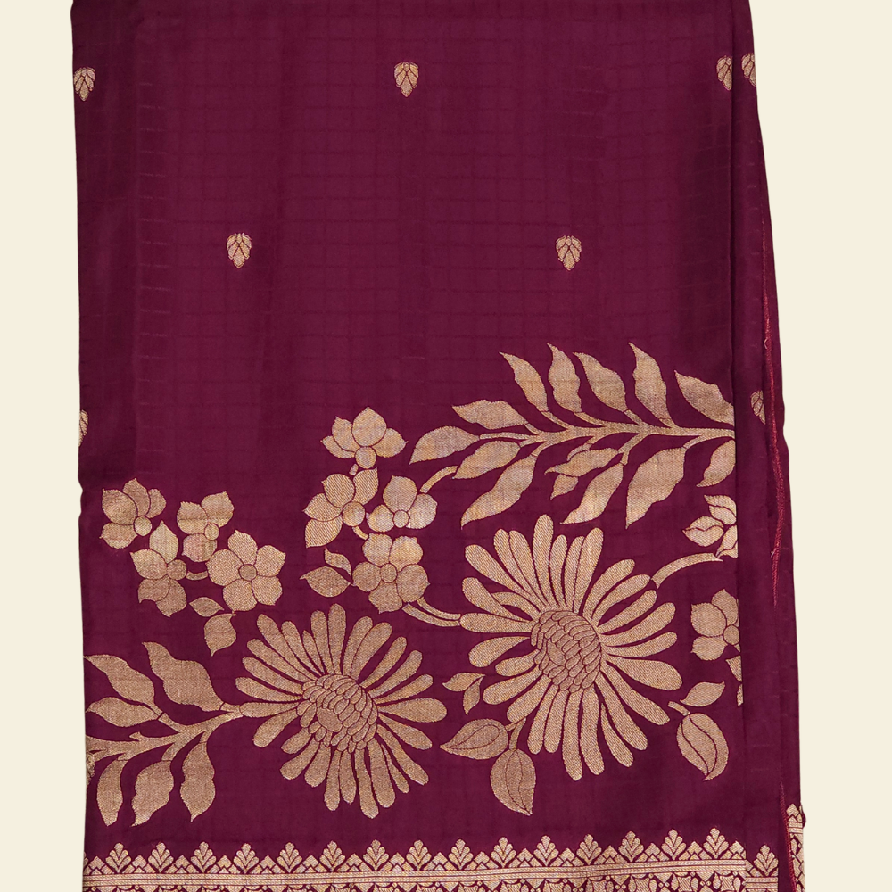 Traditional Banarasi silk saree featuring small zari woven borders and matching blouse with zari motifs.
