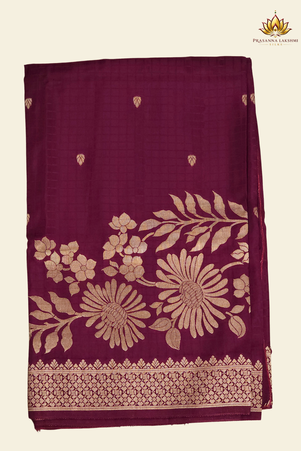 Traditional Banarasi silk saree featuring small zari woven borders and matching blouse with zari motifs.
