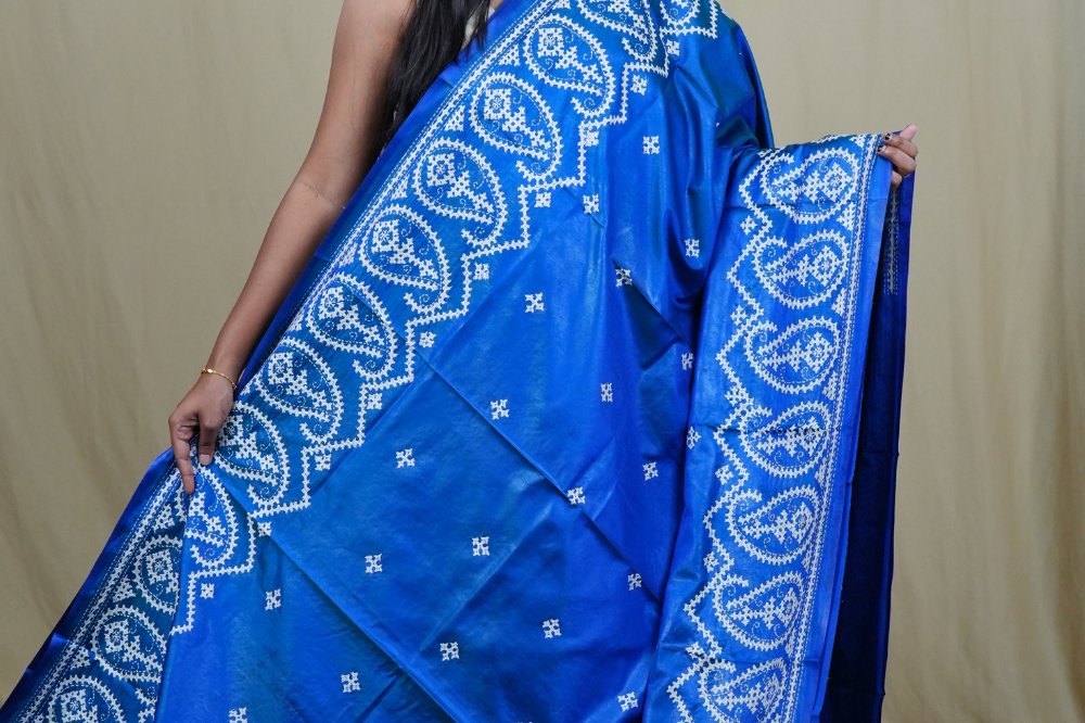 Traditional semi silk saree featuring beautiful hand Kutch work borders and artistic design.
