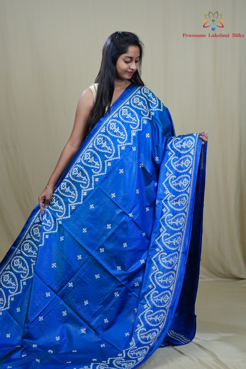 Traditional semi silk saree featuring beautiful hand Kutch work borders and artistic design.
