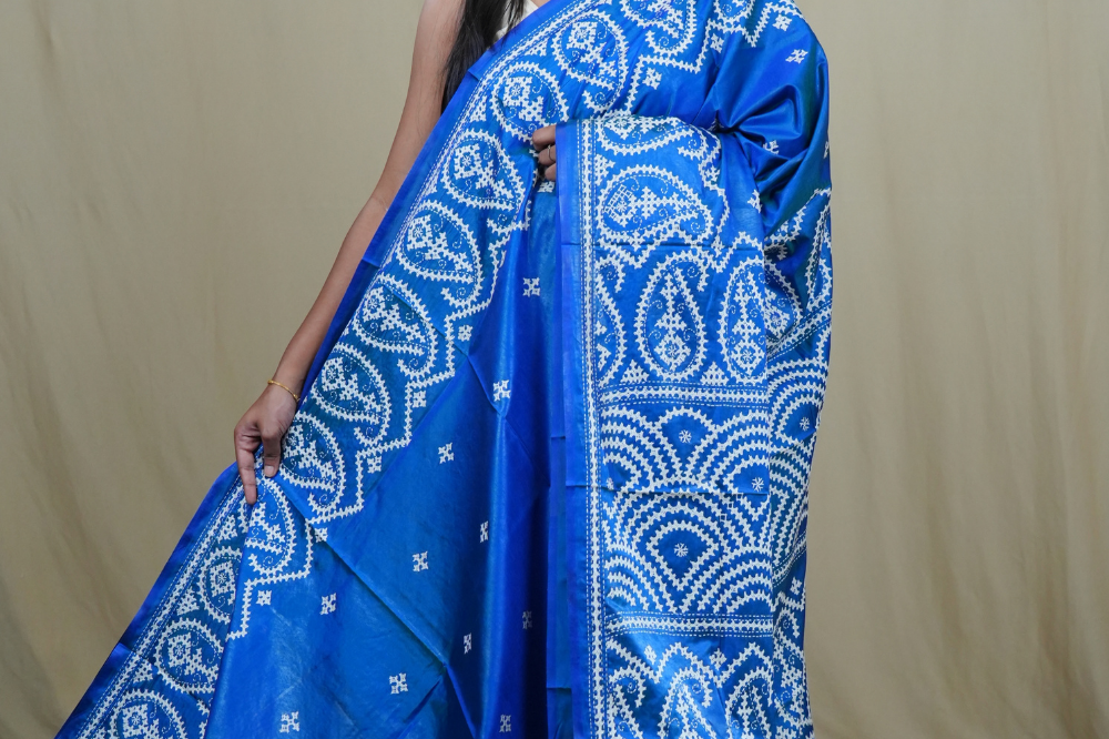 Semi Bangalore Silk Saree with all-over Kutch work motifs and rich embroidered pallu.
