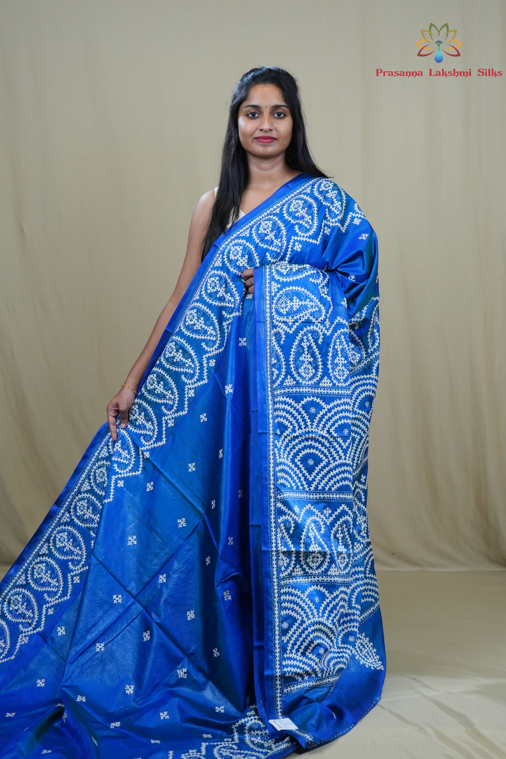 Semi Bangalore Silk Saree with all-over Kutch work motifs and rich embroidered pallu.
