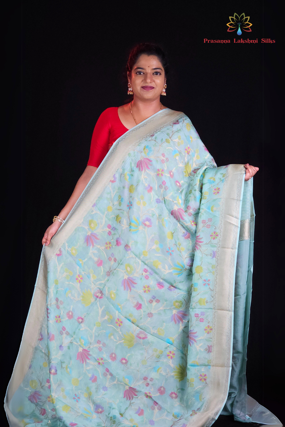 “Elegant floral organza saree with zari border”