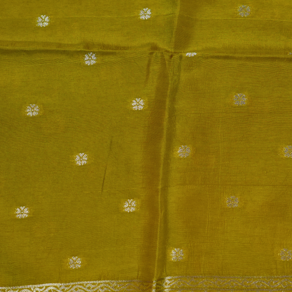 Traditional Banarasi silk saree featuring small zari woven borders and matching blouse with zari motifs.
