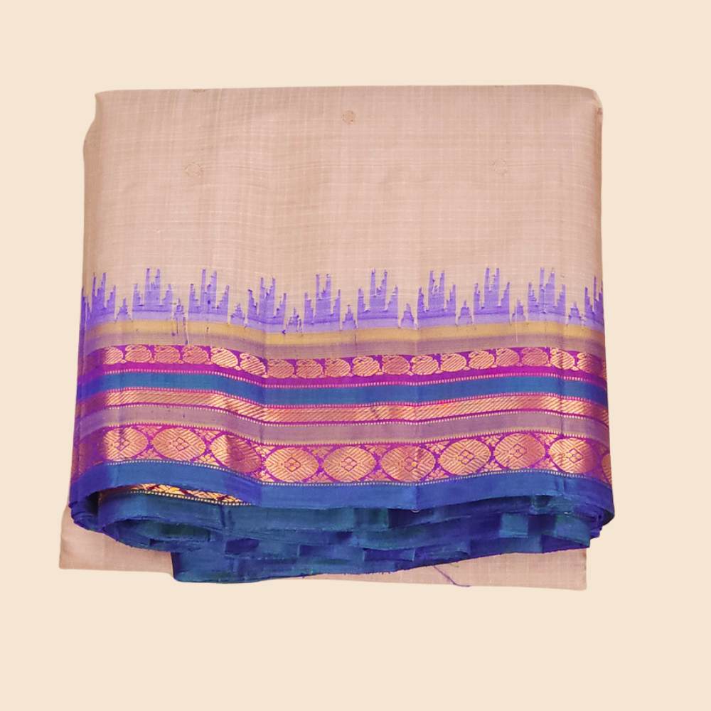 Traditional Gadwal SiCo saree featuring exquisite zari woven borders and blouse piece.
