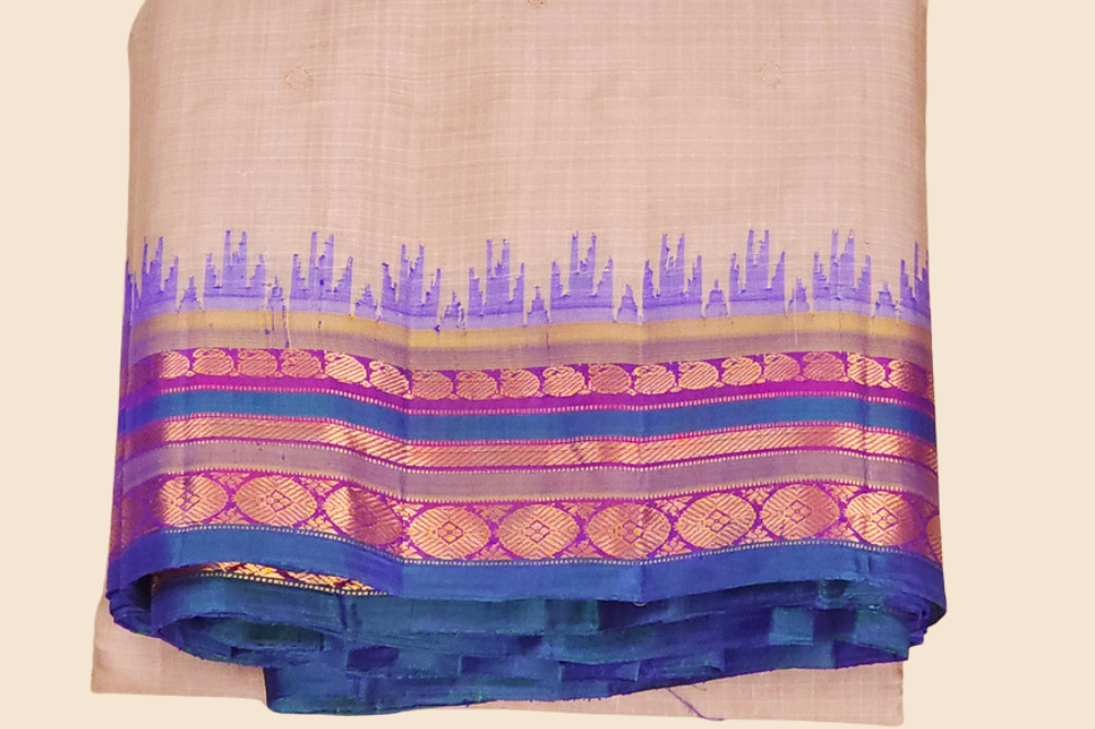 Traditional Gadwal SiCo saree featuring exquisite zari woven borders and blouse piece.
