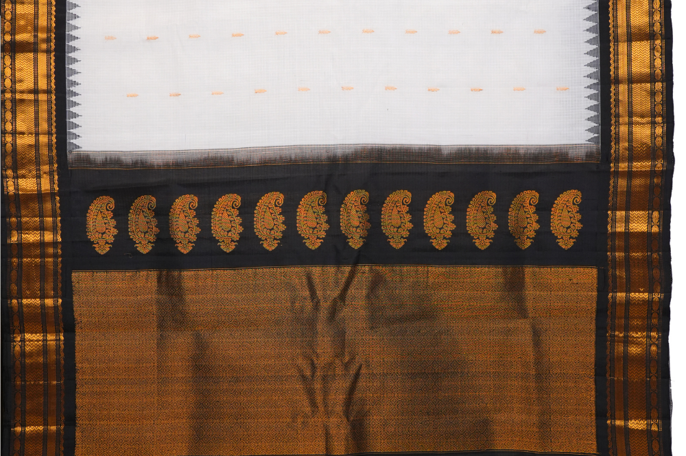 Traditional Gadwal SiCo saree featuring exquisite zari woven borders and blouse piece.
