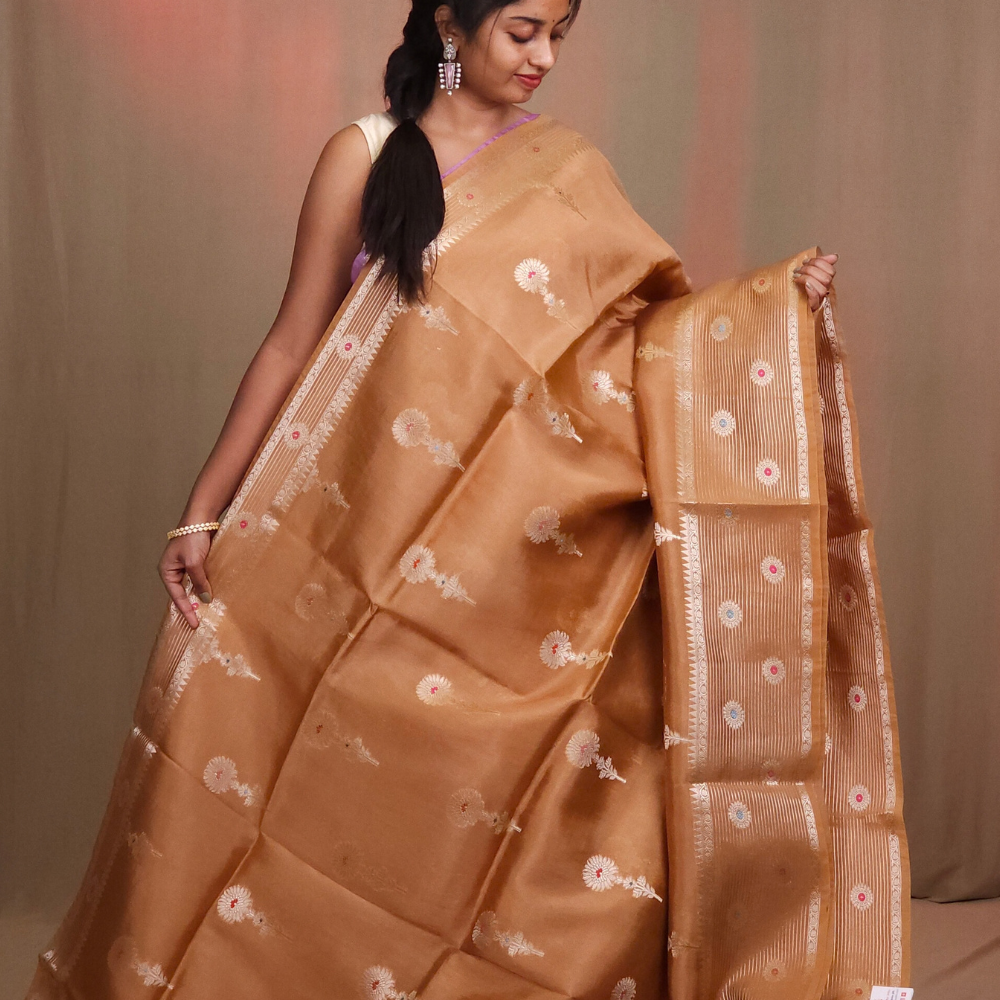 Traditional Chiniya silk saree featuring zari woven borders and stripe design
