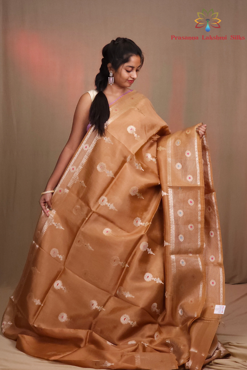 Traditional Chiniya silk saree featuring zari woven borders and stripe design
