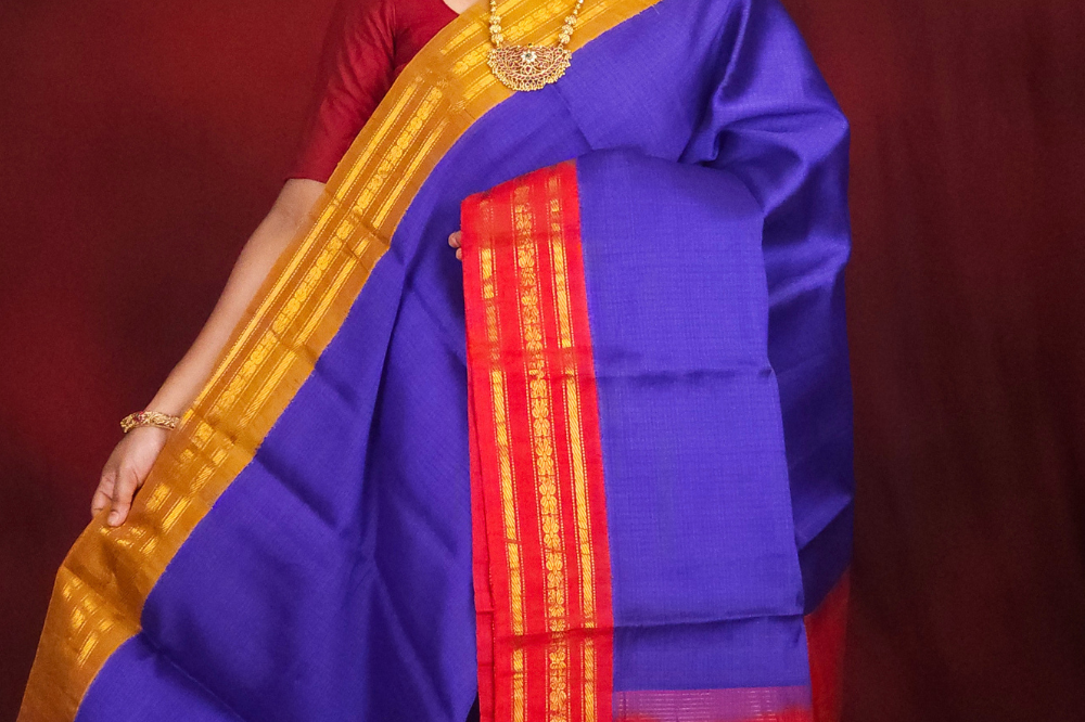 Lightweight Gadwal cotton saree featuring elegant zari border and striped pallu design.
