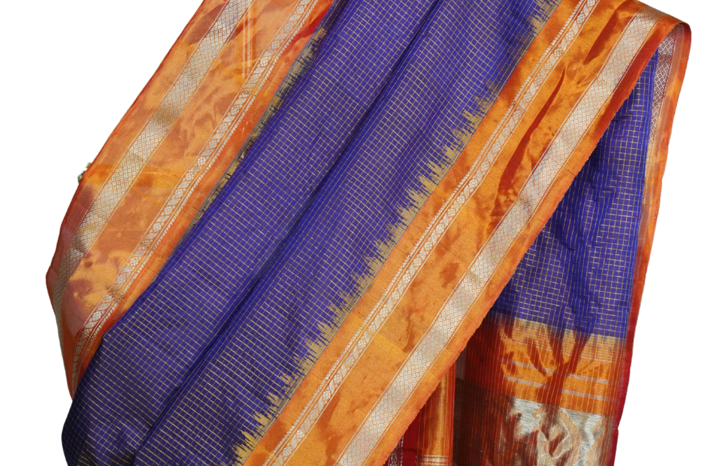 Handloom Gadwal pure tissue silk saree with intricate zari motifs and muniya borders.
