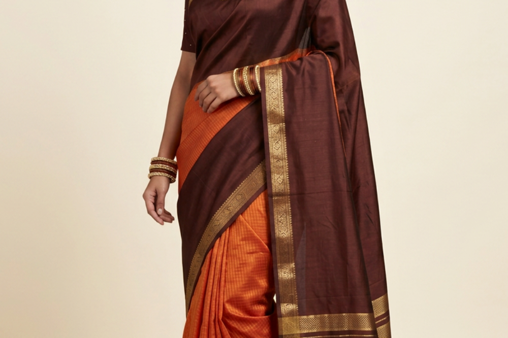 Rust Orange and Chocolate Brown Banarasi Munga saree with allover zari woven checks, contrast broad zari border, and zari striped pallu.
