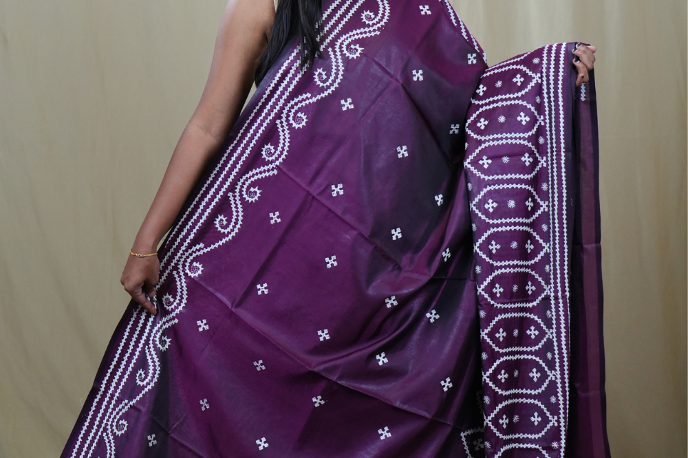 Traditional semi silk saree featuring beautiful hand Kutch work borders and artistic design.
